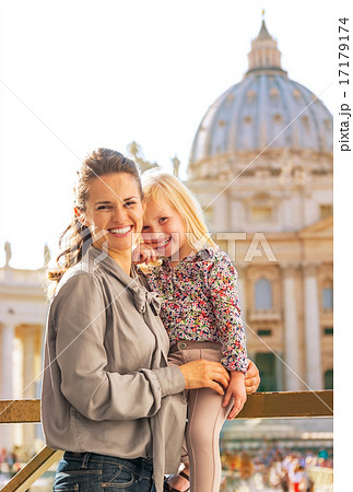 Portrait of happy mother and baby girl on piazza san pietro in v 17179174