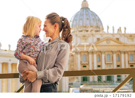 Portrait of happy mother and baby girl on piazza san pietro in v 17179192
