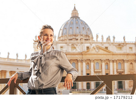 Portrait of happy young woman in front of basilica di san pietro Portrait of happy young woman in front of basilica di san pietro 17179212