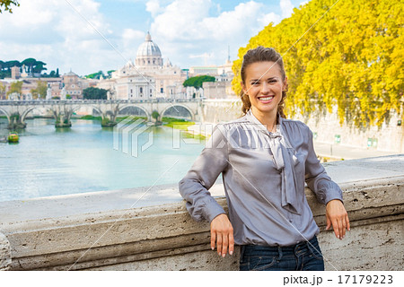 Young woman standing on bridge ponte umberto I with view on basi Young woman standing on bridge ponte umberto I with view on basi 17179223