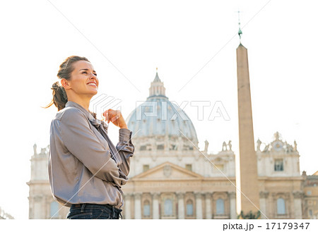 Portrait of young woman in front of basilica di san pietro in va 17179347