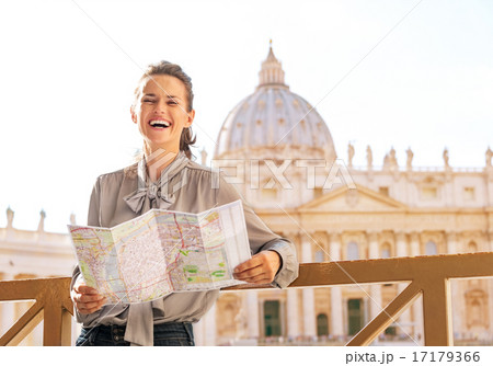 Happy young woman in front of basilica di san pietro in vatican 17179366