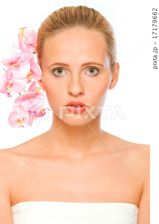Young beautiful woman with pink orchids in her hair. Young beautiful woman with pink orchids in her hair. 17179662