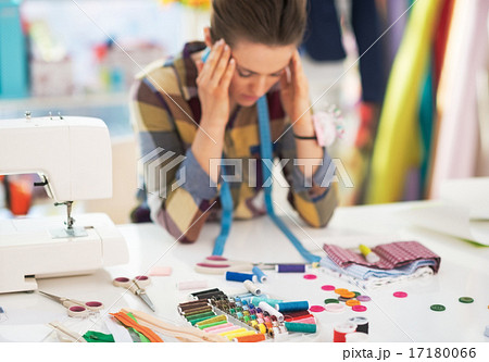 Portrait of stressed tailor woman at work 17180066