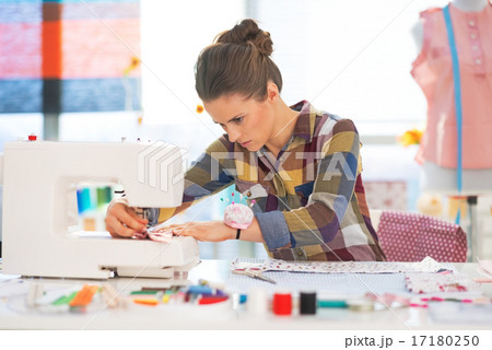 Seamstress working in studio 17180250