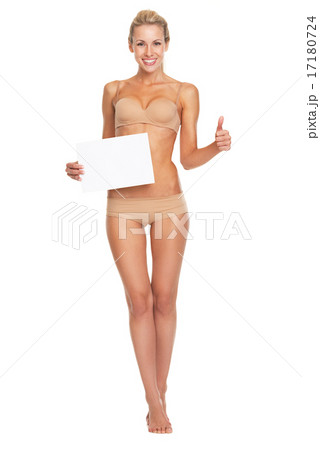 Full length portrait of happy young woman in lingerie showing bl Full length portrait of happy young woman in lingerie showing bl 17180724