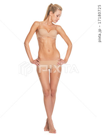 Full length portrait of relaxed young woman in lingerie Full length portrait of relaxed young woman in lingerie 17180725