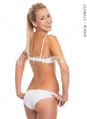 Portrait of smiling young woman in lingerie 17180737