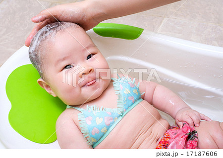 Mom washing baby hair 17187606