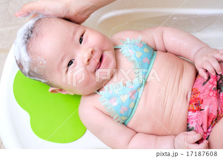 Mom washing baby girl hair 17187608