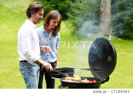 couple cooking outdoors 17189361