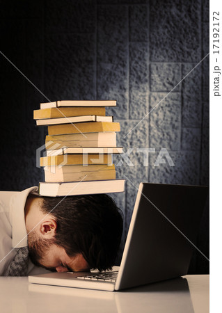 Composite image of exhausted businessman sleeping head on laptop 17192172