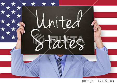 Composite image of businessman showing board 17192183