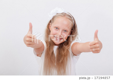 Portrait of a beautiful girl showing thumbs up on white Portrait of a beautiful girl showing thumbs up on white 17194857