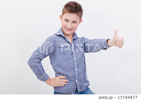 Portrait of happy boy showing thumb up gesture 17194877