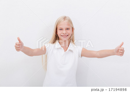 Portrait of a beautiful girl showing thumbs up on white Portrait of a beautiful girl showing thumbs up on white 17194898