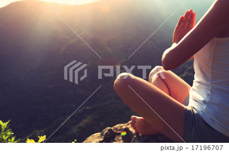 young yoga woman at sunrise mountain peak 17196707