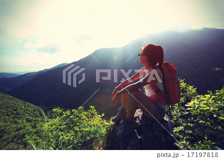woman backpacker on mountain peak enjoy the view woman backpacker on mountain peak enjoy the view 17197818