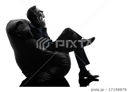 man sitting on the telephone silhouette 17198876