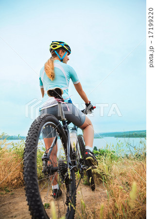 Young girl riding bicycle outside. Healthy Lifestyle. Young girl riding bicycle outside. Healthy Lifestyle. 17199220