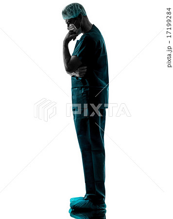 doctor surgeon man thinking with face mask full length silhouett 17199284