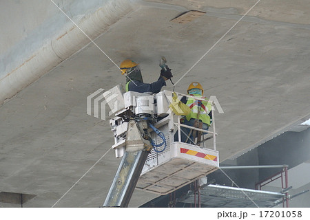 Workers standing in the mobile crane basket Workers standing in the mobile crane basket 17201058