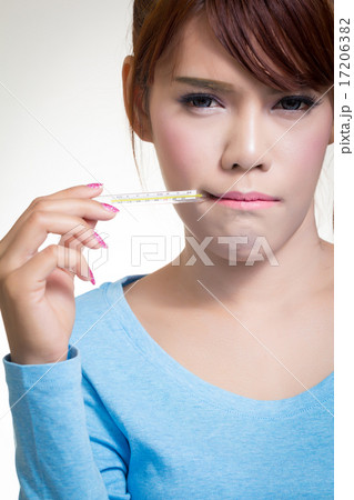 Sick woman holding thermometer 17206382