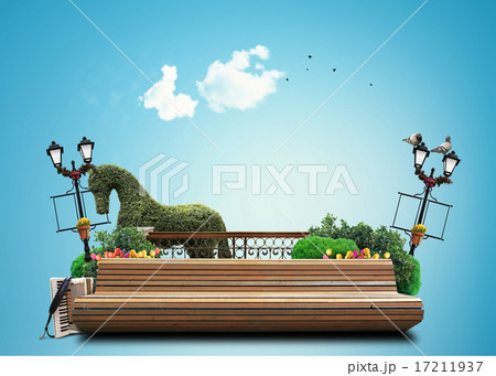 Bench in the city Park with flowers and accordion 17211937