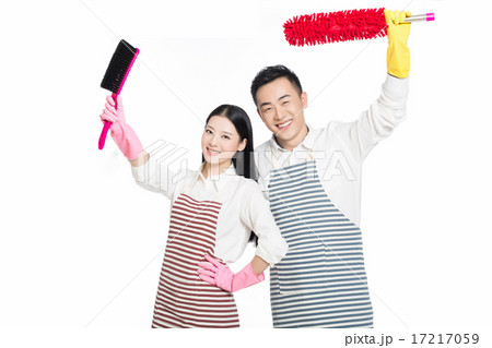 man and woman holding cleaning supplies 17217059