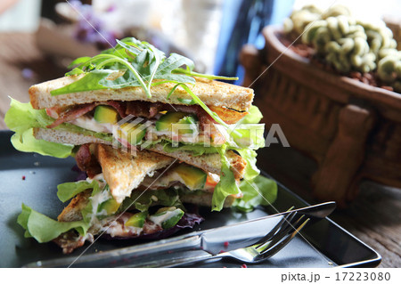 Sandwiches with meet and vegetables on wood background Sandwiches with meet and vegetables on wood background 17223080