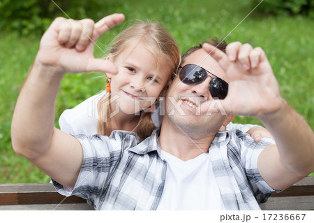 Father and daughter playing at the park at the day time. 17236667