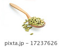 Lots of cardamom pods on wooden spoon 17237626