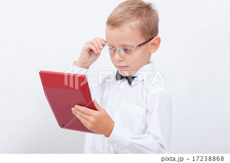 Portrait of teen boy with calculator on white background 17238868