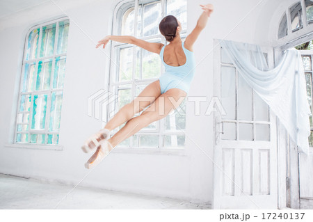 young modern ballet dancer jumping on white background 17240137