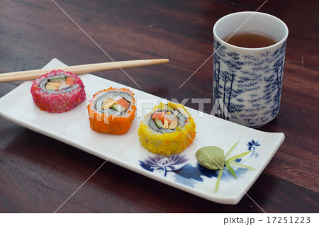 delicious sushi served  wooden table with tea 17251223