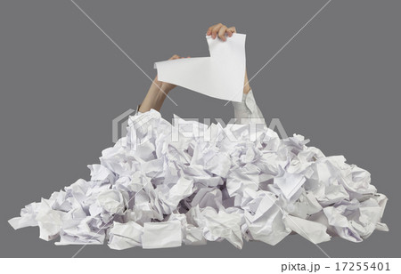 Hands with lacerated paper reaches out from papers 17255401