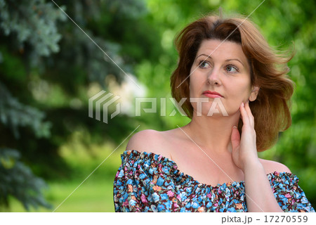 woman in a dress with open shoulders at  pine forest 17270559