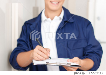 Deliverymen signing paper Deliverymen signing paper 17279517