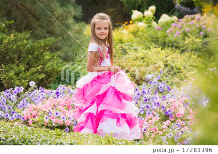 Girl Princess in the garden flower bed 17281396