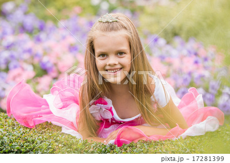 Girl princess in a beautiful dress in a bed of flowers 17281399