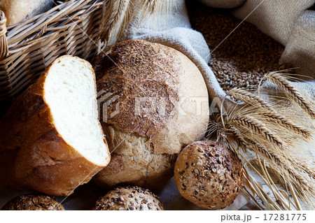 fresh bread and wheat on the wooden table fresh bread and wheat on the wooden table 17281775