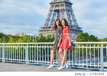 Twin sisters in front of the Eiffel tower in Paris, France Twin sisters in front of the Eiffel tower in Paris, France 17281949