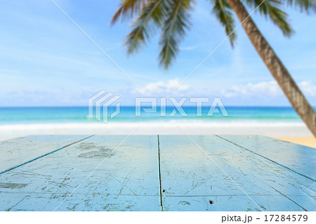 Top of wood table and view of tropical beach Top of wood table and view of tropical beach 17284579
