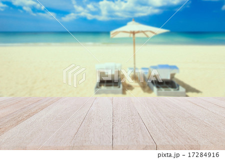Top wooden table and blur of tropical beach background Top wooden table and blur of tropical beach background 17284916
