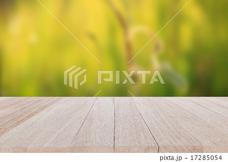 Top wooden table on blur and bokeh background Top wooden table on blur and bokeh background 17285054