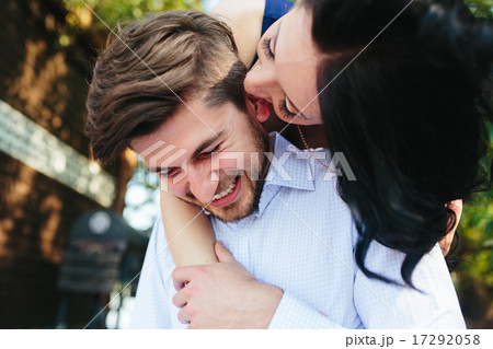 Woman Embracing Her Boyfriend From Behind 17292058
