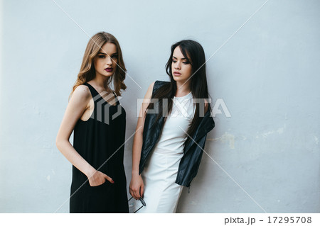 Two beautiful friends pose on white background 17295708