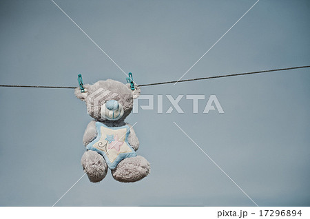 The toy bear hangs on clothespins 2358. The toy bear hangs on clothespins 2358. 17296894