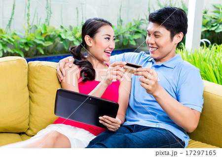 couple shopping online in internet with laptop couple shopping online in internet with laptop 17297165