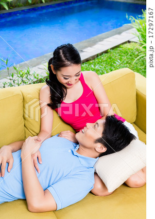 Chinese woman and man of sofa in their home Chinese woman and man of sofa in their home 17297167